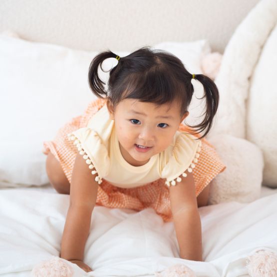 Resort Series - Girls Top with Pom Pom Sleeves in Peach